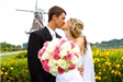 Married Couple Kissing in Front of the Windmill