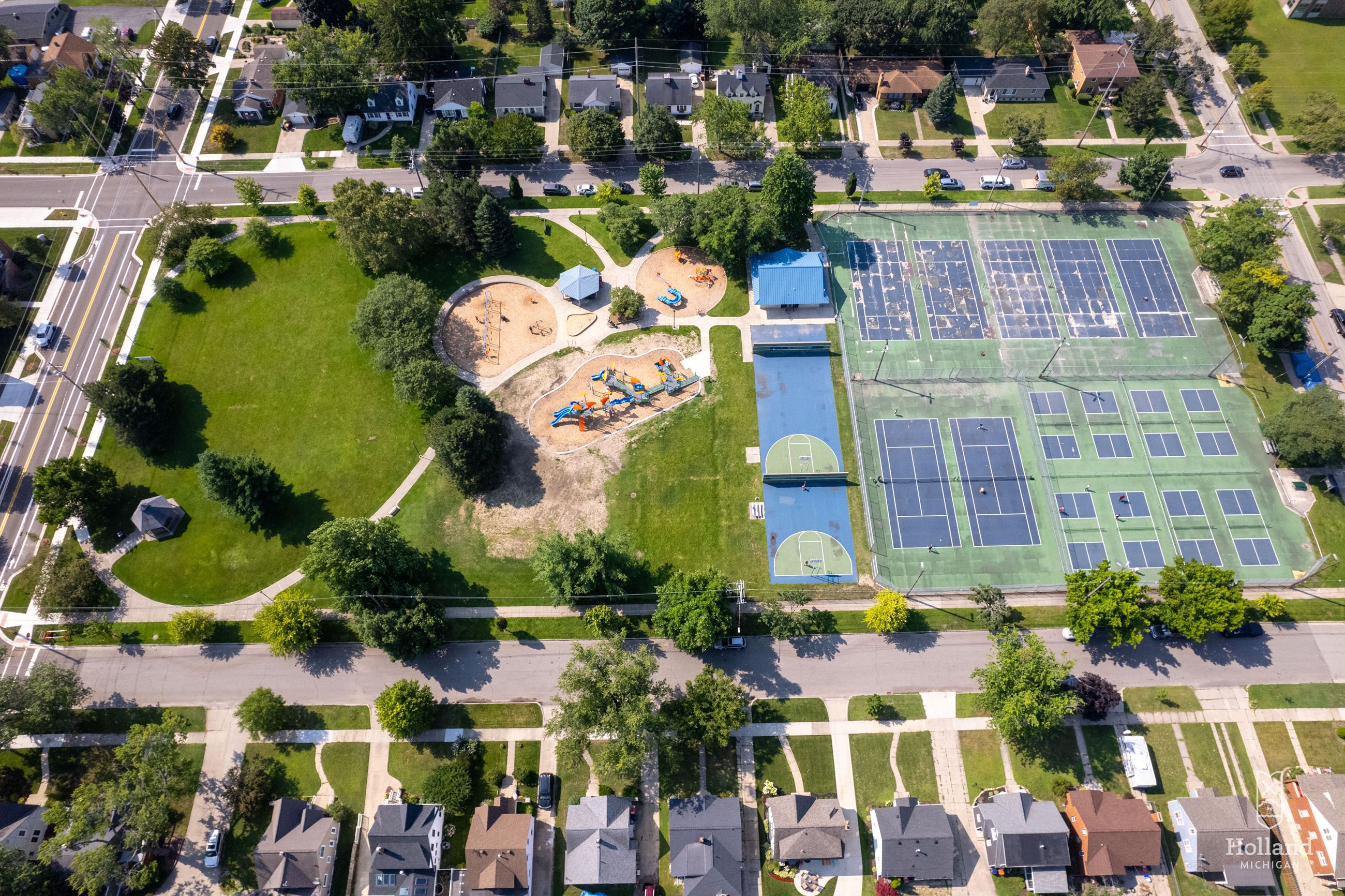 Ariel view of park with playground, tennis courts