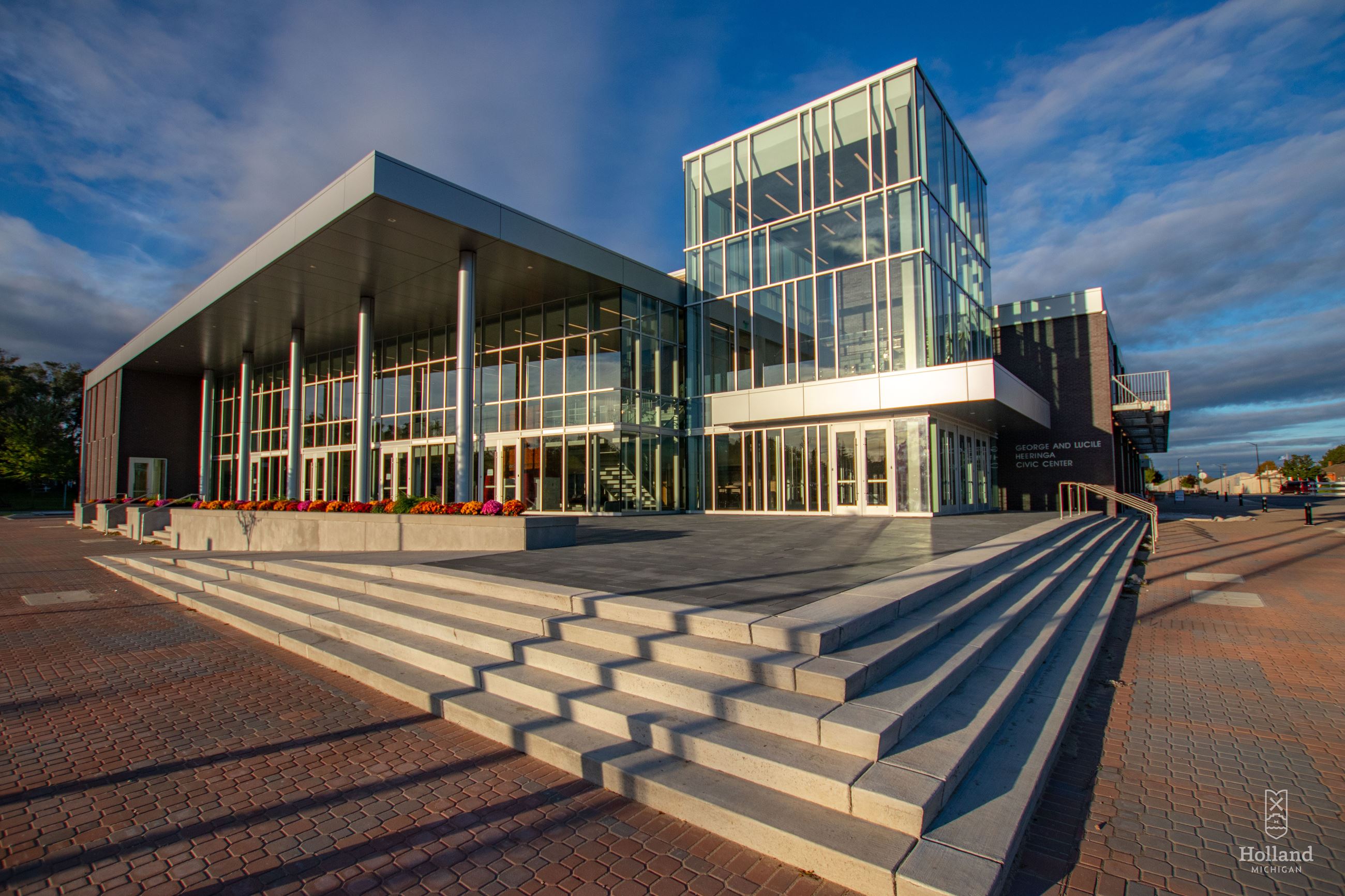 Holland Civic Center - 2-story builiding with glass front and concrete steps 