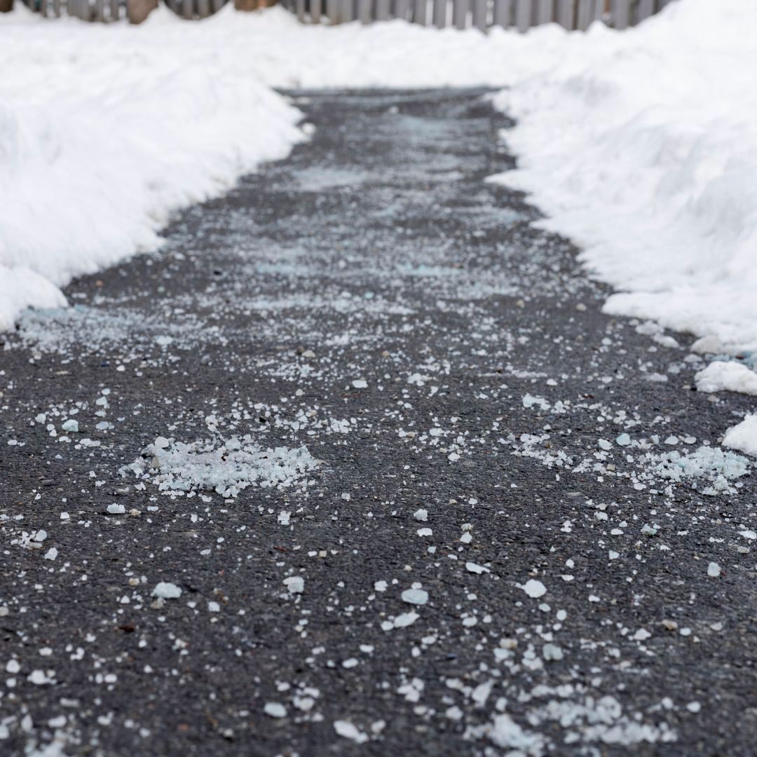 path with de-icing salt and snow on each side of path