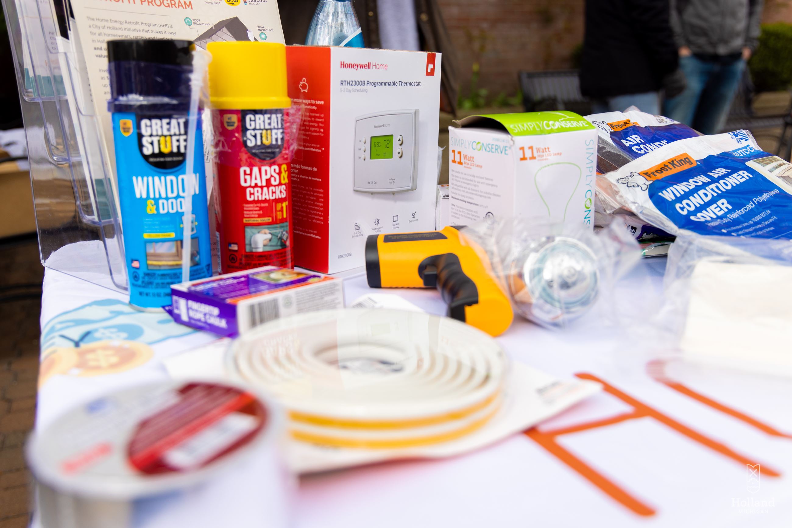 A variety of home energy efficiency items displayed on a table.