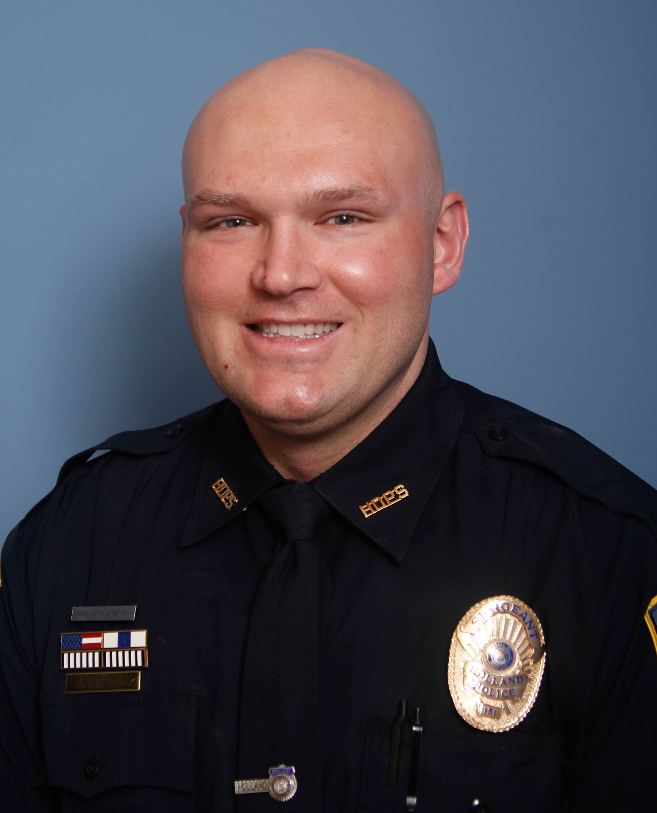 professional portrait of a male police in uniform, no hat