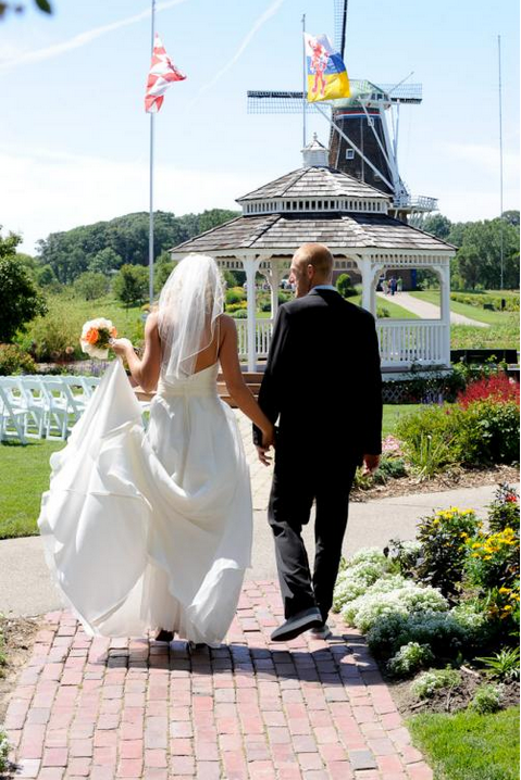 Wedding Couple Walking Towards the Gazebo