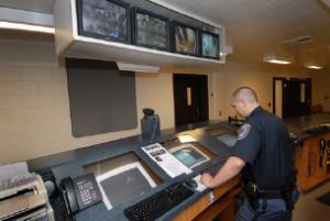 Officer at a Booking Station